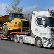 Heavy cat lorry on JJP Haulage Ltd Scania Lorry