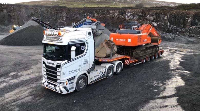 JJP Haulage Ltd Scania Lorry with JCB cargo on the back